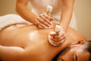 closeup man getting back massage with detox herbal balls health spa 768x512 1